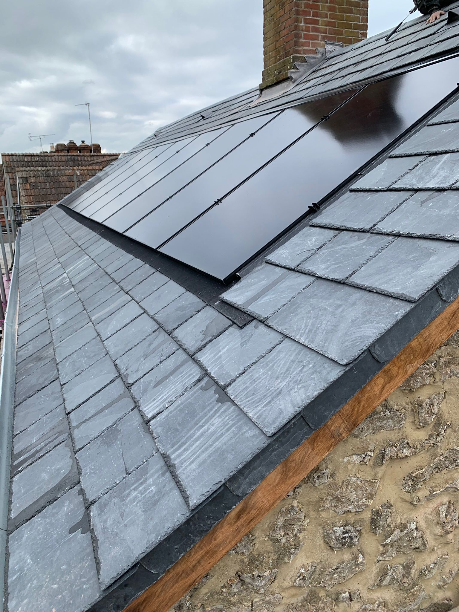 Solar panels installed on the slate roof of Rose Cottage